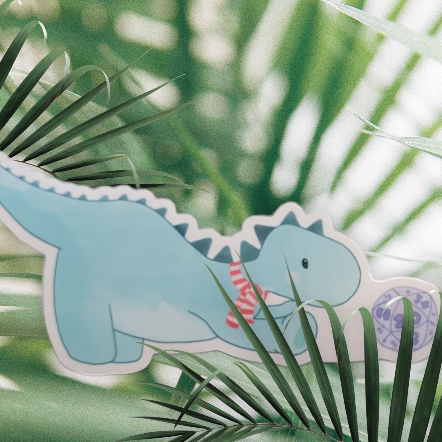 Dinosaur playing with a D20 Sticker