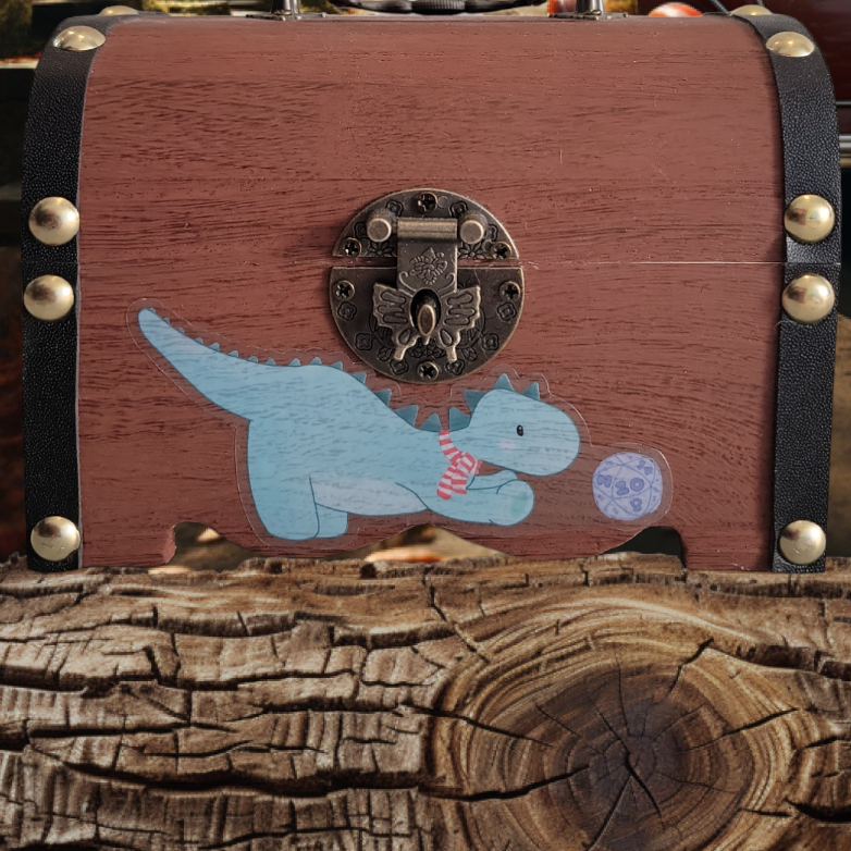 Dinosaur playing with a D20 Sticker